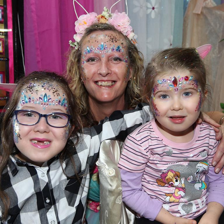 Bella Cluff, 6, Estelle Whiteley and Rylee Cluff, 3, get bedazzled. Picture: Richard Gosling