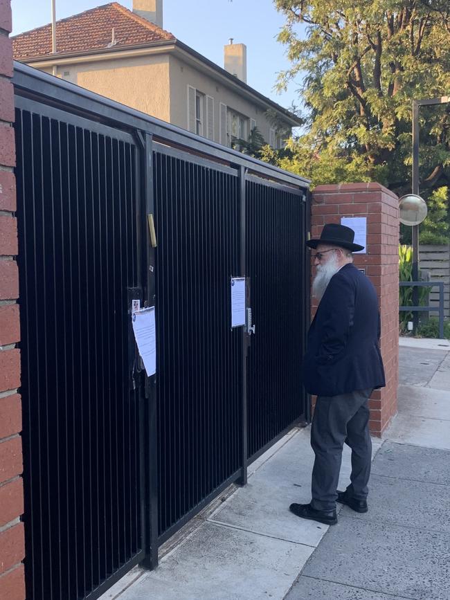 A man reads the notice at the school gate this morning. Picture: Brianna Travers