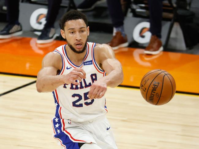 (FILES) In this file photo taken on February 13, 2021, Ben Simmons of the Philadelphia 76ers passes the ball during the first half of the NBA game against the Phoenix Suns at Phoenix Suns Arena in Phoenix, Arizona. NOTE TO USER: User expressly acknowledges and agrees that, by downloading and or using this photograph, User is consenting to the terms and conditions of the Getty Images License Agreement.   Christian Petersen/Getty Images/AFP - Simmons was hit with a one-game suspension by the team on October 19, 2021, ruling him out of the club's season opener against New Orleans. A Sixers statement said Simmons would miss the October 20 game against the Pelicans for "conduct detrimental to the team." US media reports said Simmons was suspended shortly after a bust-up with Sixers coach Doc Rivers, which ended with the Australian point guard being tossed from practice. (Photo by Christian Petersen / GETTY IMAGES NORTH AMERICA / AFP)