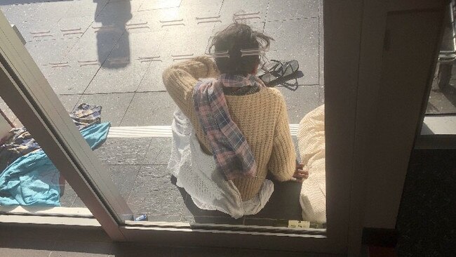 A homeless woman outside a business in Southport.