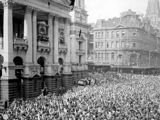 Thousands of fans packed the streets to see the band at the Melbourne Town Hall when the Beatles arrived for their state reception. Picture: Herald Sun Image Library