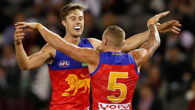 Josh Schache celebrates a goal with Mitch Robinson.