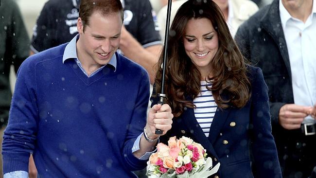 Prince William and Catherine, Duchess of Cambridge, arrive in the rain at the Viaduct Basin in Auckland.