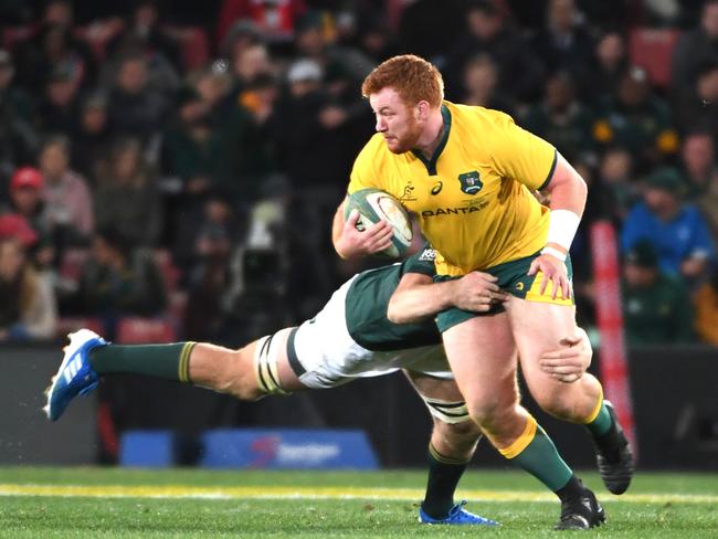 Harry Johnson-Holmes hits the ball for Australia during his debut Test against South Africa. Picture: Lee Warren/Gallo Images/Getty Images