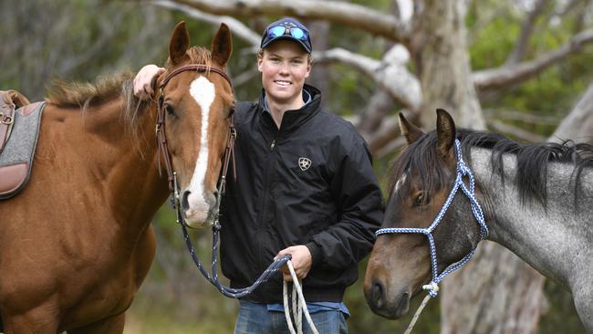 Toby Judd, 17, with his horses Spinifex and Ace. Picture: Naomi Jellicoe