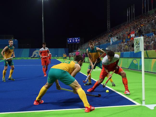 Netherlands' Valentin Verga, right, tries to get himself out of the corner during a men's field hockey quarter final match against Australia at the 2016 Summer Olympics in Rio de Janeiro, Brazil, Sunday, Aug. 14, 2016. (AP Photo/Dario Lopez-Mills)