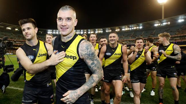 Captain Trent Cotchin congratulates Dustin Martin after his 200th game in the qualifying final win against Hawthorn on Thursday night. Picture: Adam Trafford/AFL Media/Getty Images