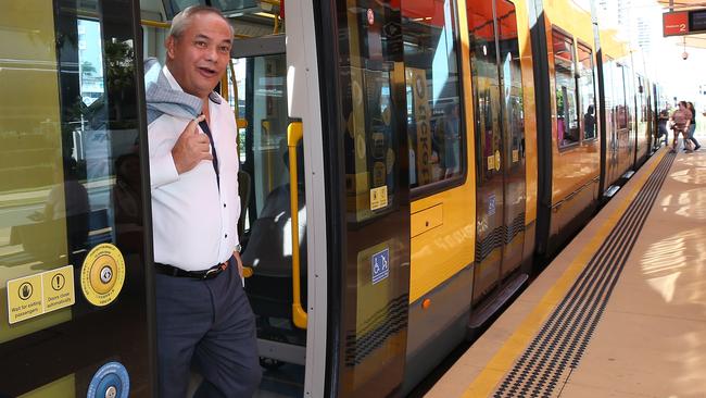 Mayor Tom Tate rides the tram. Picture Glenn Hampson