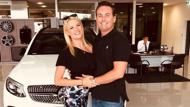 Ian and Sophie Chester posing in front of a Mercedes Benz at a dealership – Photo Supplied Facebook