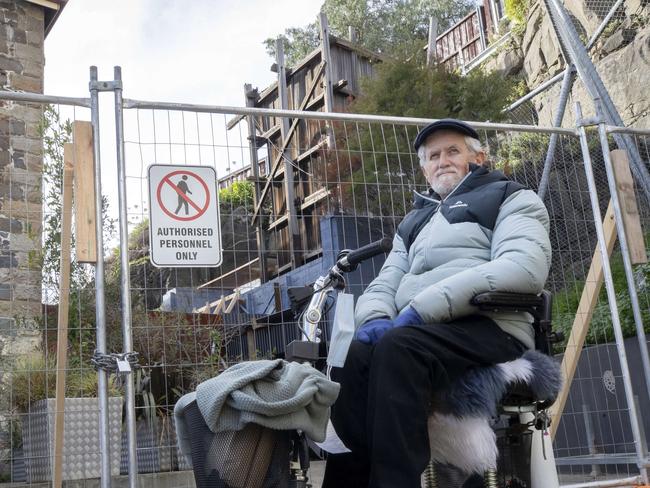 Salamanca Arts board member Ian Broinowski if front of the historic coal shaft used for the old jam factory at Salamanca Square.  Picture: Chris Kidd