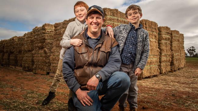 Adelaide brothers and singers Ethan, 11 and Toby, 7, raised $9500 by busking to donate to drought-affected farmers like Karl Zerner. Picture: Brad Fleet