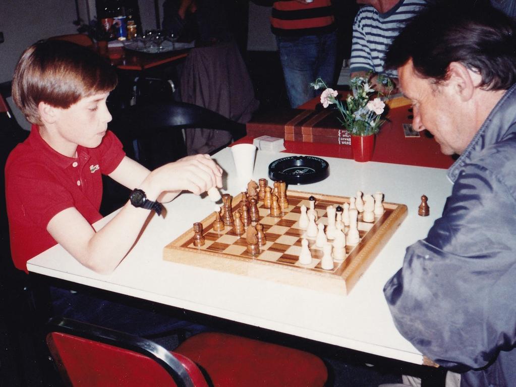 An 11-year-old Prince William (L) playing a game of chess during one of his first visits to homelessness charity, The Passage in London, taken on June 14, 1993. Picture: AFP