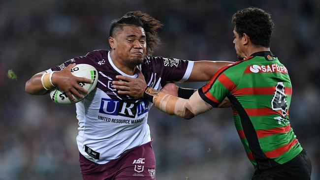 Moses Suli of the Sea Eagles fends off a tackle from Dane Gagai of the Rabbitohs during the First Semi Final between the South Sydney Rabbitohs and the Manly Sea Eagles in week 2 of the NRL Finals Series at ANZ Stadium in Sydney, Friday, September 20, 2019. (AAP Image/Dan Himbrechts) NO ARCHIVING, EDITORIAL USE ONLY