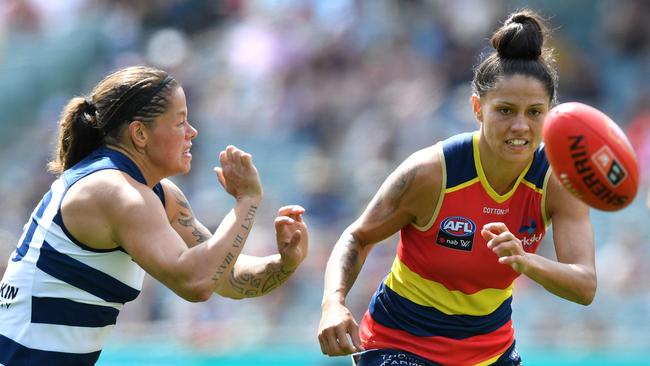 Stevie-Lee Thompson prepares to pounce on the ball ahead of Geelong’s Richelle Cranston. Picture: AAP Image/David Mauriz