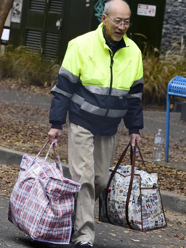 Residents are seen carrying their personal