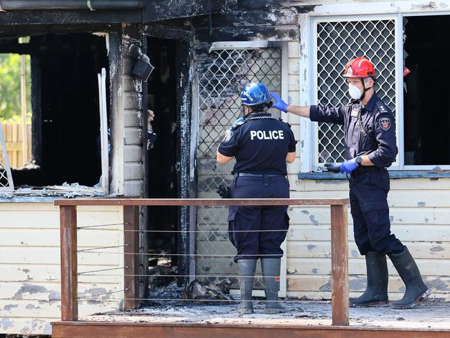 Police and fire investigators at the scene on Thursday. Picture: Tertius Pickard