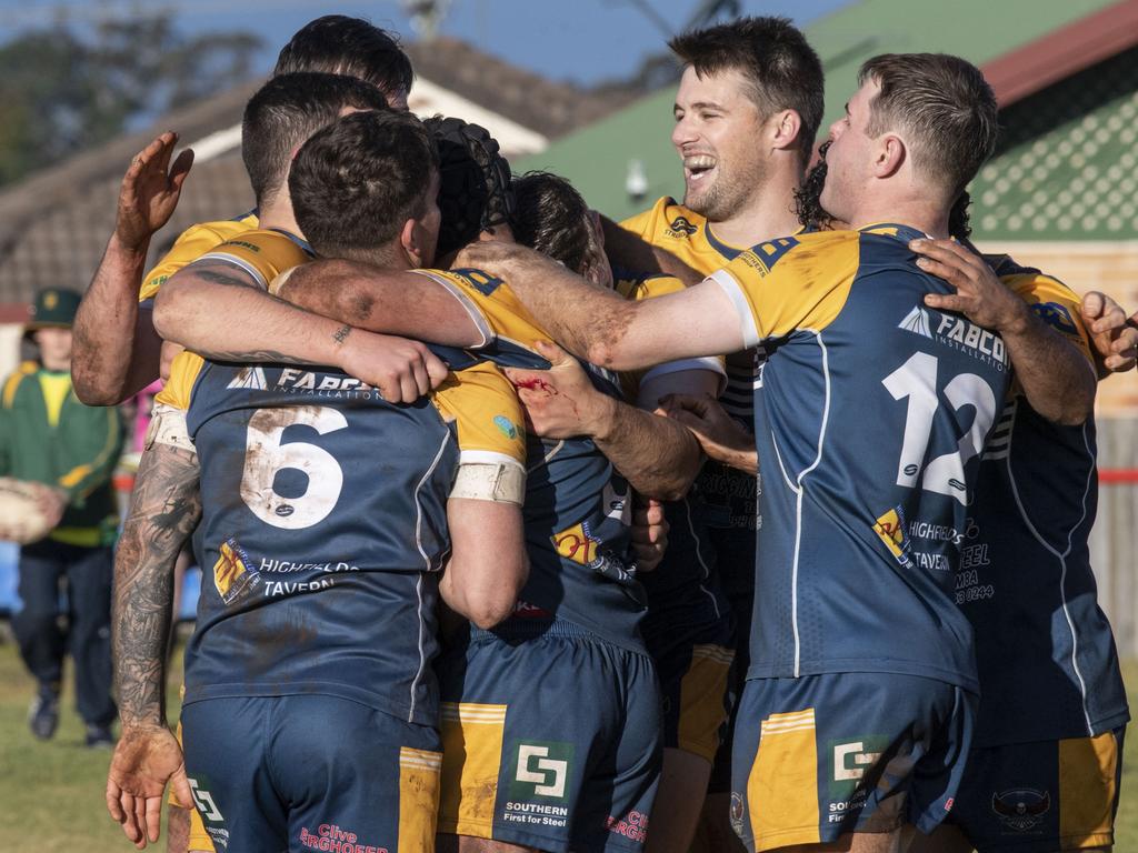 Highfields players post try celebration. Picture: Nev Madsen.