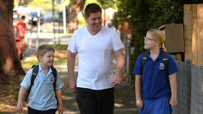 Paul Evans walking his children Bennett and Jazmin to Mosman Public School. Picture: Elenor Tedenborg