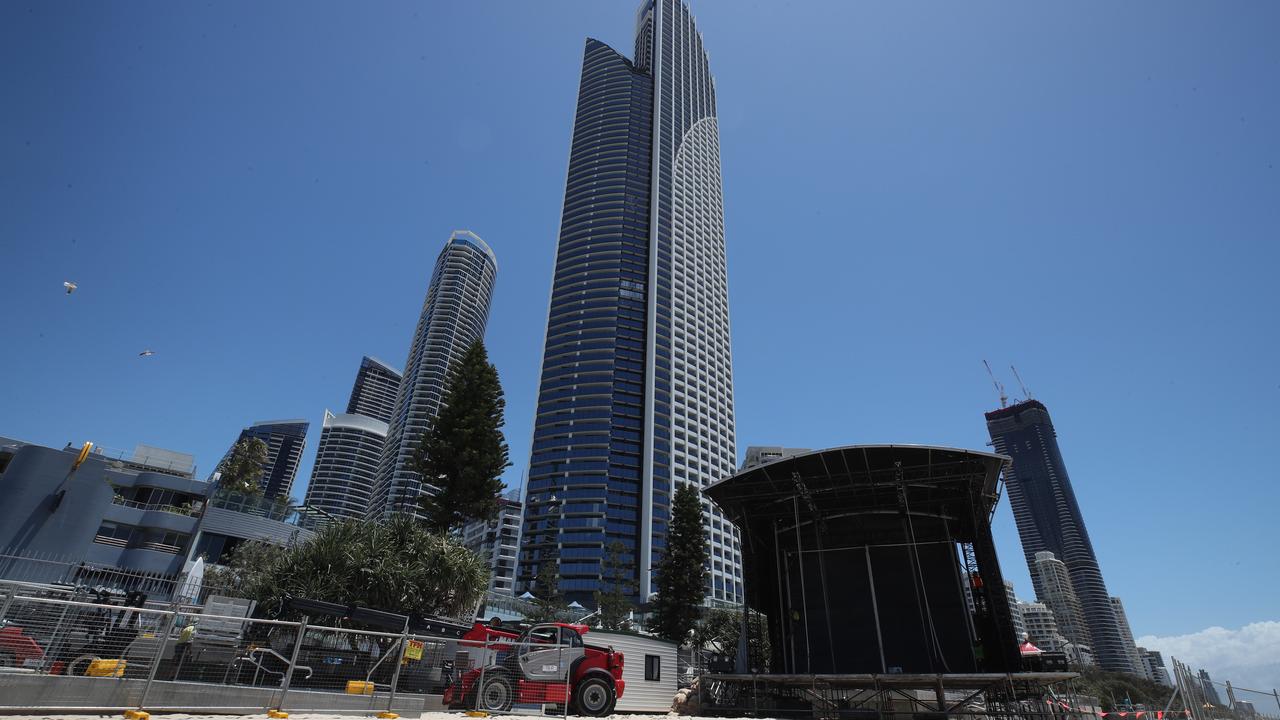 Workmen putting up infrastructure in preparations for Schoolies 2021 at Surfers Paradise. Picture: Glenn Hampson.