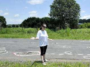 Lorelle (surname withheld) a resident on Dunoon Rd at Tullera, is concerned there will be an accident if the pot-holes on the busy road are not fixed soon. Picture: Cathy Adams 