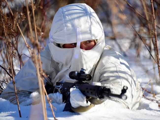 PRIMORYE TERRITORY, RUSSIA - FEBRUARY 2, 2017: A serviceman with a rifle during military exercises conducted by the Russian Pacific Fleet's naval infantry unit at the Bamburovo firing range. The drills are a part of preparations for the Suvorov Attack and Sniper Line army competitions. Yuri Smityuk/TASS (Photo by Yuri Smityuk\\TASS via Getty Images)