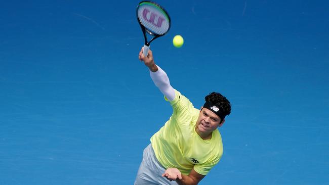 Milos Raonic of Canada serves during his fourth-round match against Marin Cilic at Margaret Court Arena. Picture: AAP