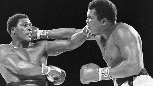 Trevor Berbick &amp; Muhammad Ali seem to have an equal reach as they slug it out in this 12/12/81 file photo in Nassau, Bahamas.