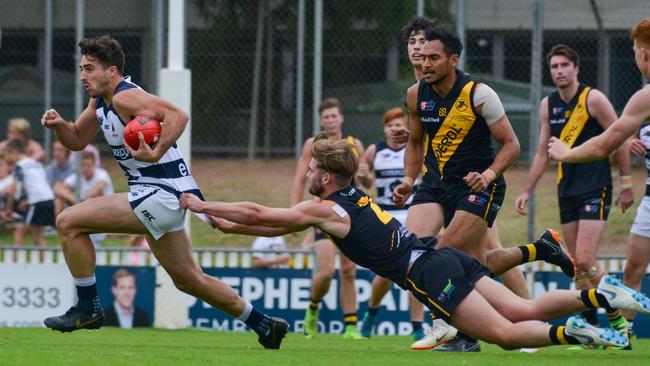 SANFL: Glenelg v South Adelaide at Glenelg Oval, Saturday, April 13, 2019. Jonty Scharenberg tries to stop South's Nic Schwarz. (AAP Image/Brenton Edwards),