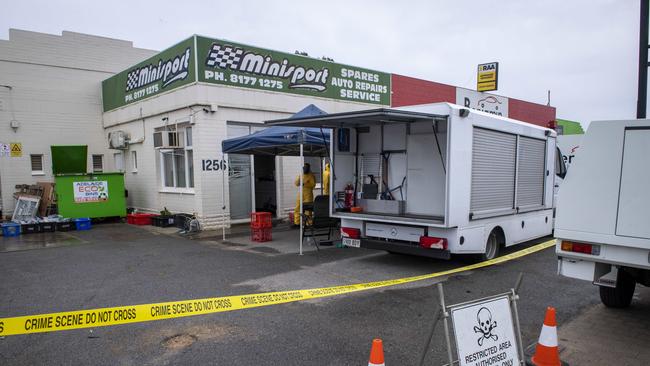 Police investigate and dismantle the drug lab at an abandoned workshop on South Rd, Clovelly Park. Picture: Mark Brake