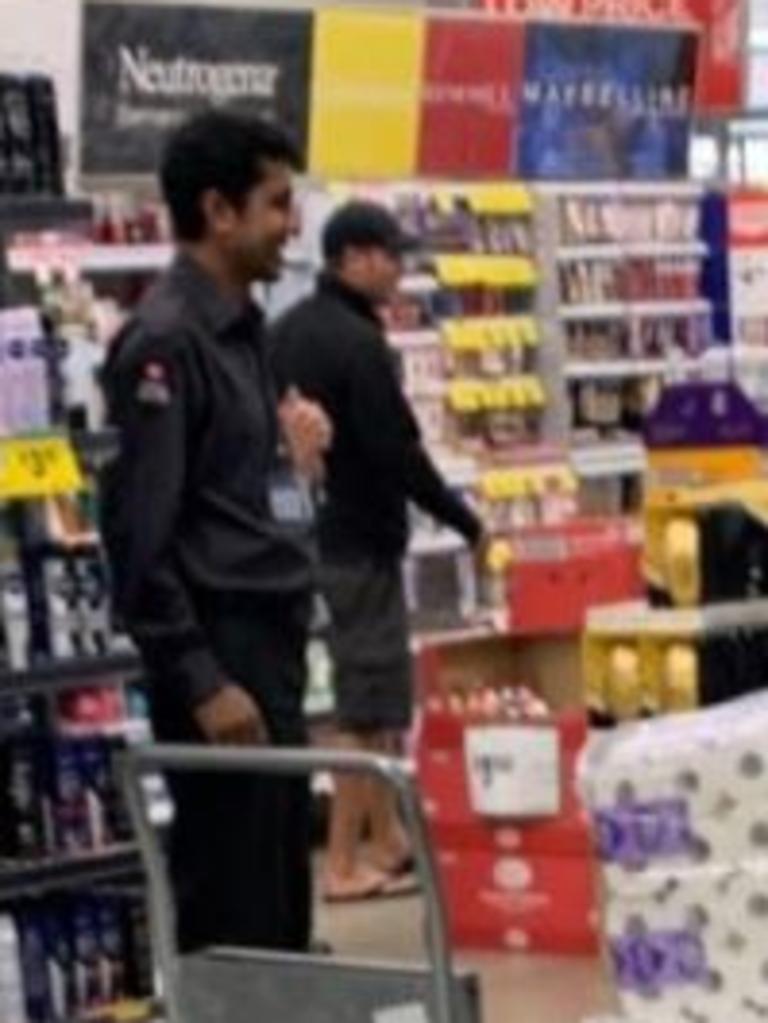 A security guard can be seen guarding toilet paper pallets