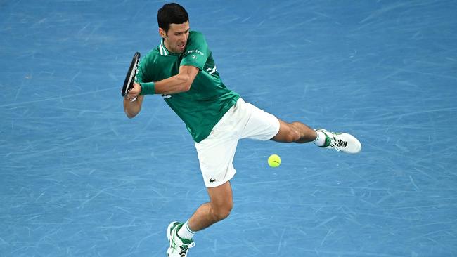 Novak Djokovic plays a backhand in his men's Singles first round match against Jeremy Chardy. Picture: Getty Images