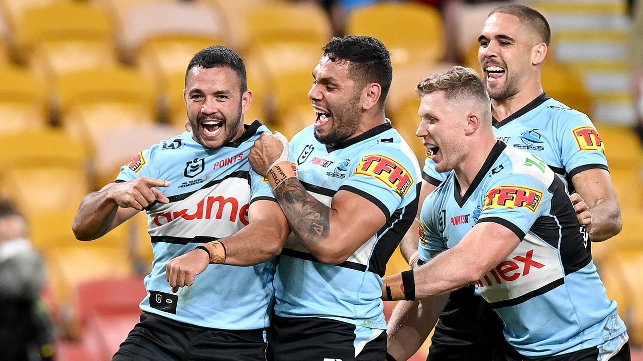 BRISBANE, AUSTRALIA - AUGUST 28: Braydon Trindall of the Sharks celebrates scoring a try during the round 24 NRL match between the Cronulla Sharks and the Brisbane Broncos at Suncorp Stadium, on August 28, 2021, in Brisbane, Australia. (Photo by Bradley Kanaris/Getty Images)