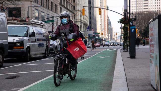 A bike messenger carries a DoorDash Inc. bag during a delivery in New York. Picture: Bloomberg