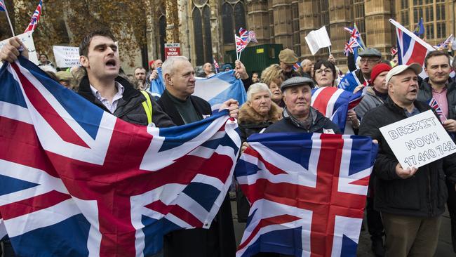 Pro-Brexit demonstrators hold Union Jack flags as they protest outside the Houses of Parliament on November 23, 2016 in London, England. Picture: Jack Taylor/Getty Images