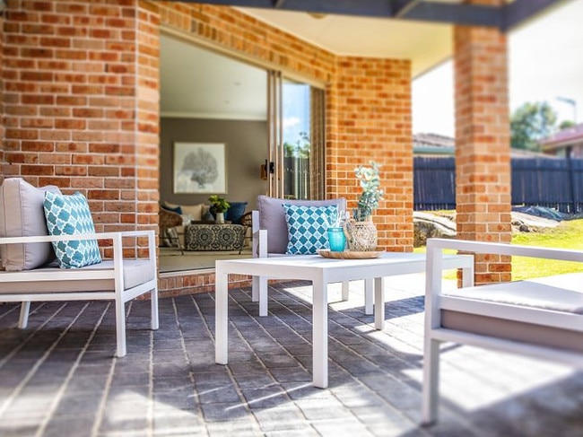 A sunny spot to relax beside the lawn.