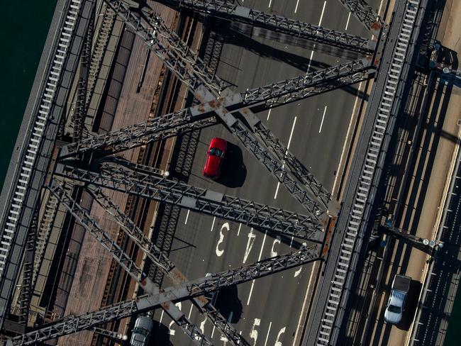 Sparse traffic crosses the usually clogged Sydney Harbour Bridge. Picture: Cameron Spencer/Getty Images