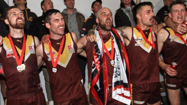 Grice, middle with flag, has capped off his return season with a premiership medal. Picture: Davis Harrigan