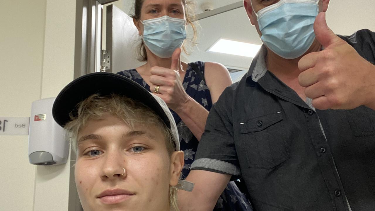 El Chaston with their parents Trish and Paul before heading in for top surgery in Brisbane in January 2023. Picture: Supplied