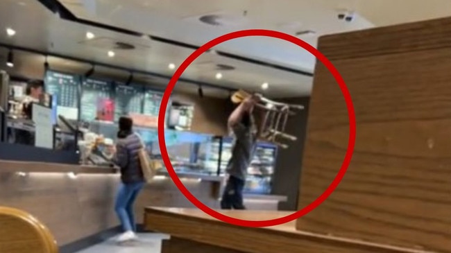 A man has been filmed attacking a Starbucks counter in Melbourne with chair. Picture: TikTok / caradnopal