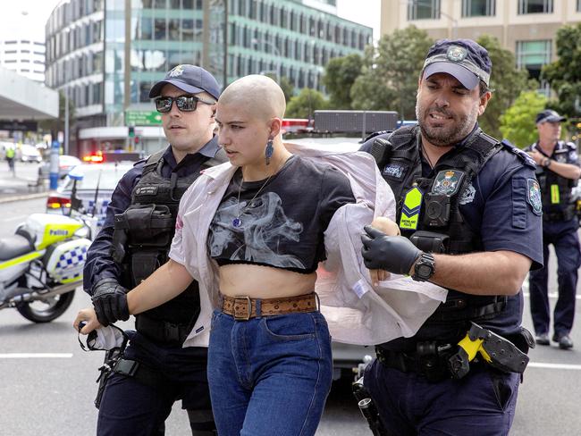 A protesters is removed by police outside Queensland Police headquarters in Brisbane. Picture: NCA NewsWire / Sarah Marshall