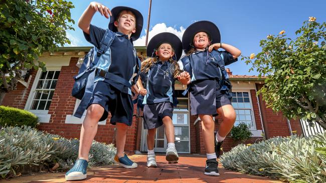 Mason, 5, Bella, 5, and Poppy, 5 are ready for their first day of school. Picture: Tim Carrafa