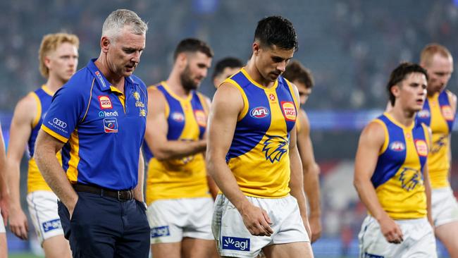 MELBOURNE, AUSTRALIA - MARCH 31: Adam Simpson, Senior Coach of the Eagles and Liam Duggan of the Eagles leave the field after a loss during the 2024 AFL Round 03 match between the Western Bulldogs and the West Coast Eagles at Marvel Stadium on March 31, 2024 in Melbourne, Australia. (Photo by Dylan Burns/AFL Photos via Getty Images)