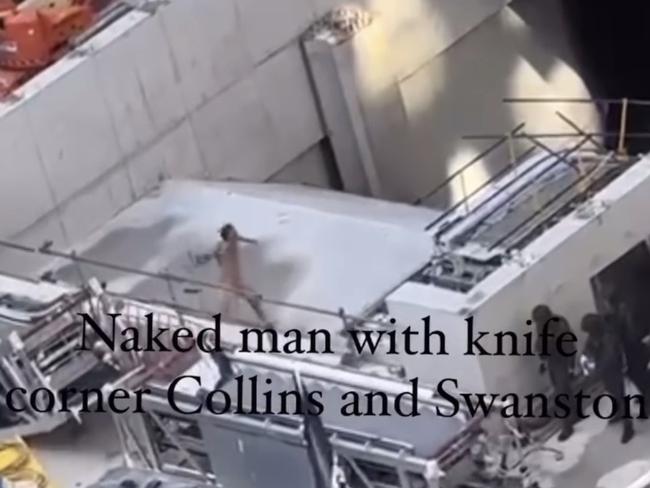 A man is captured in a standoff with police after scaling a Melbourne building site. Picture: Jacqueline Felgate