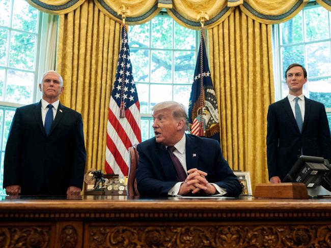 US President Donald Trump flanked by VP Mike Pence (left) and adviser Jared Kushner (right) announces a "peace deal" between Israel and Bahrain. Picture: AFP