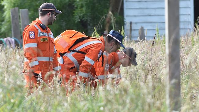 SES volunteers search the property yesterday. Picture: Lawrence Pinder