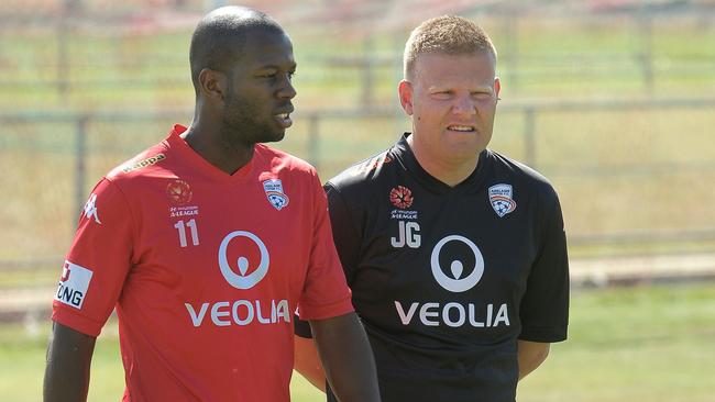 Bruce Djite with then Adelaide United coach Josep Gombau. Picture: Nicholas Wrankmore