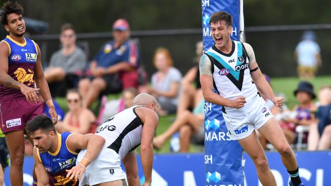 Zak Butters (right) celebrates a goal in Port’s first pre-season game against Brisbane last month. Picture: AAP/Darren England