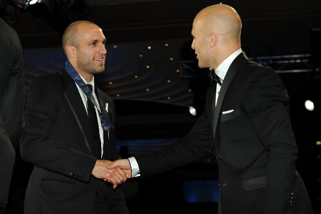 <p>2009 winner Gary Ablett congratulates this year's winner, Chris Judd. Picture: Michael Dodge</p>