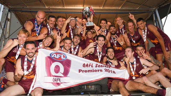 Palm Beach Currumbin players celebrate winning the QAFL Grand Final against Broadbeach at Leyshon Park. Photo: Albert Perez/AFL Media/Getty Images