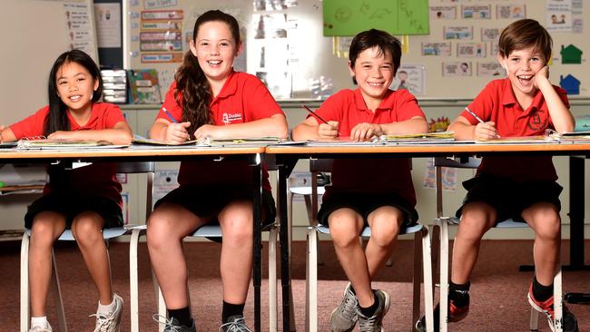 Donburn Primary School, with students Atiya, Laura, Vaughan and Xavier, has improved its NAPLAN results. Picture: Jay Town